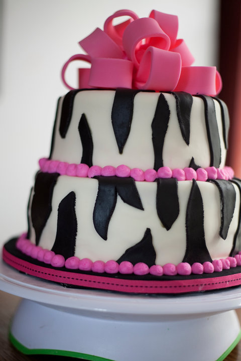 Birthday cake with zebra stripes with hot pink bow and accents Feeds 3035