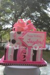 pink and brown stripes and polka dots birthday present cake