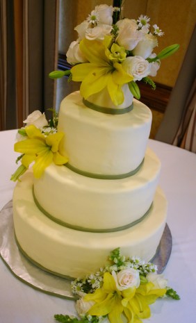 The Ciara buttercup yellow and sage green wedding cake